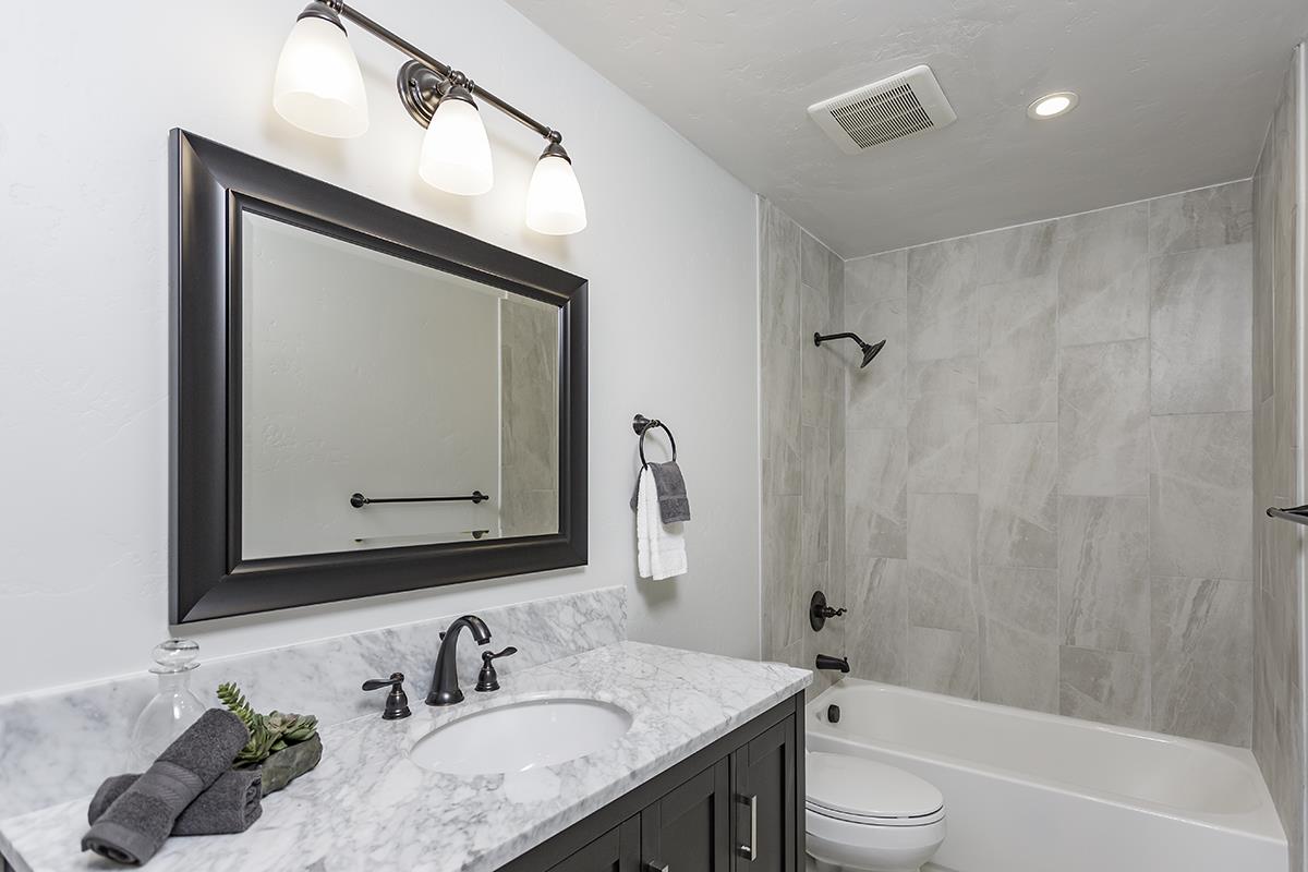 1 Little Creek Road Soquel, CA 95073 - Photo 12 of 21 a bathroom with a granite countertop sink toilet and shower