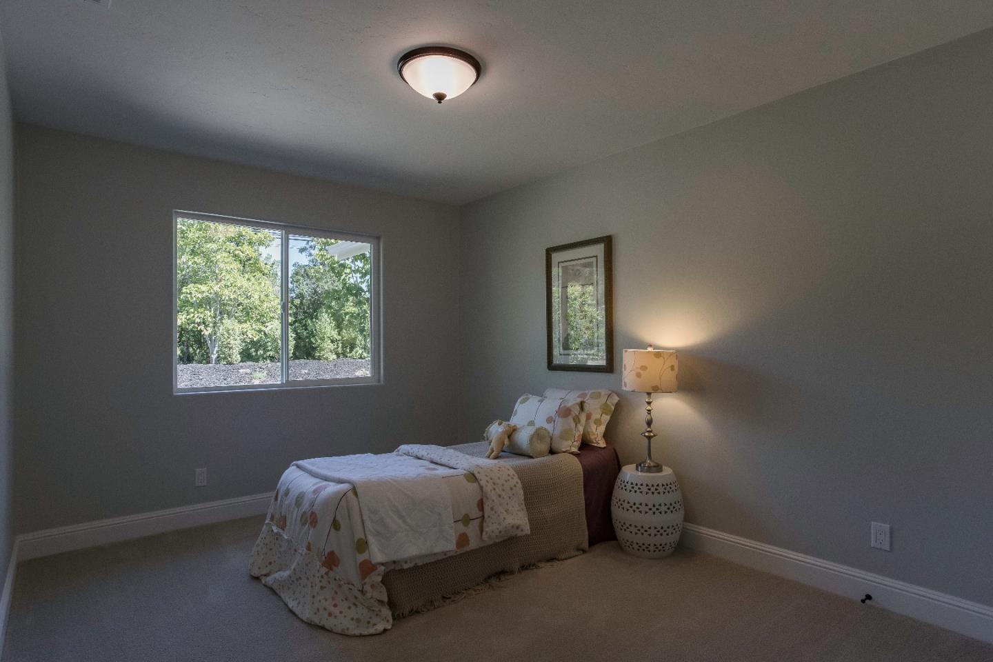 1 Little Creek Road Soquel, CA 95073 - Photo 21 of 21 a bed sitting in a bedroom next to a window