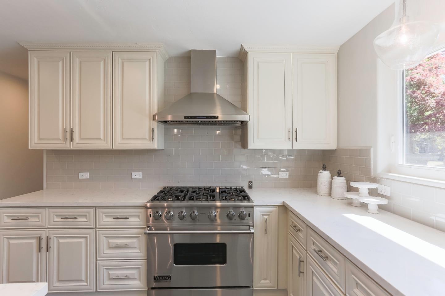 1 Little Creek Road Soquel, CA 95073 - Photo 6 of 21 a kitchen with stainless steel appliances granite countertop white cabinets and a stove