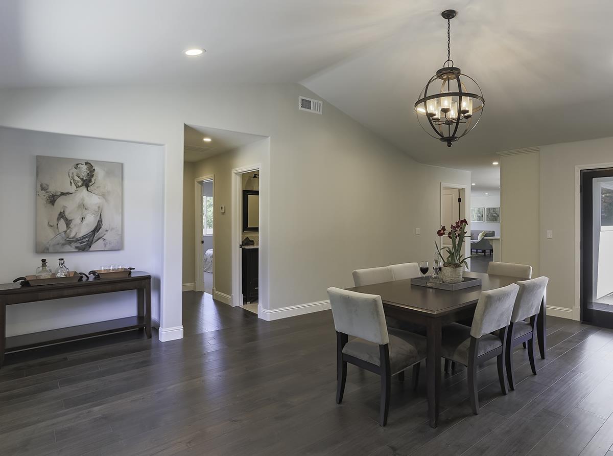 1 Little Creek Road Soquel, CA 95073 - Photo 9 of 21 a view of a dining room with furniture wooden floor and a chandelier