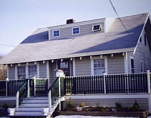 a front view of a house with glass windows