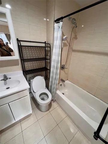 a bathroom with a sink a toilet and a bathtub