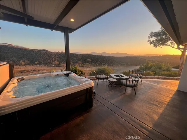 a view of an outdoor sitting area with furniture