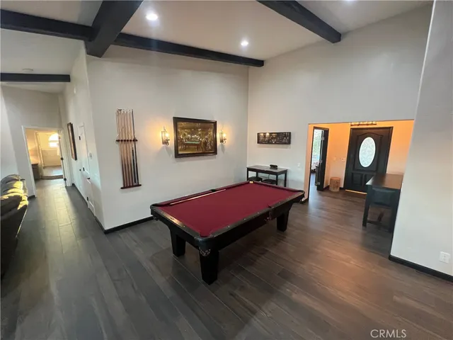 a living room with hard wood flooring and a couch