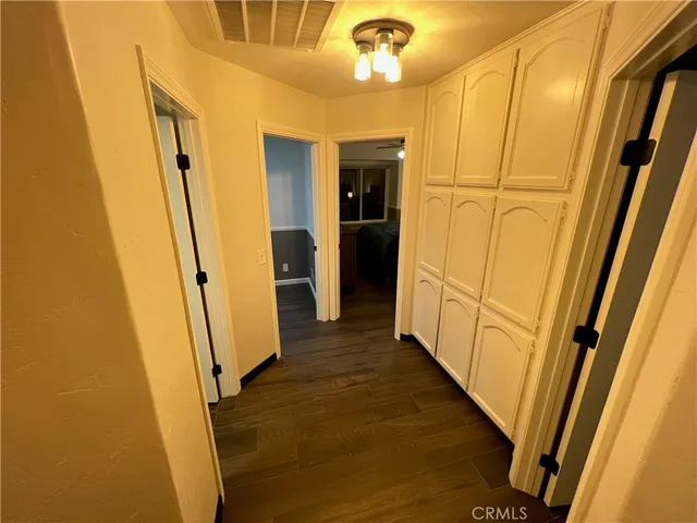 a bedroom with a bed and a chair