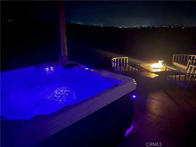 a view of a chairs and table in the patio