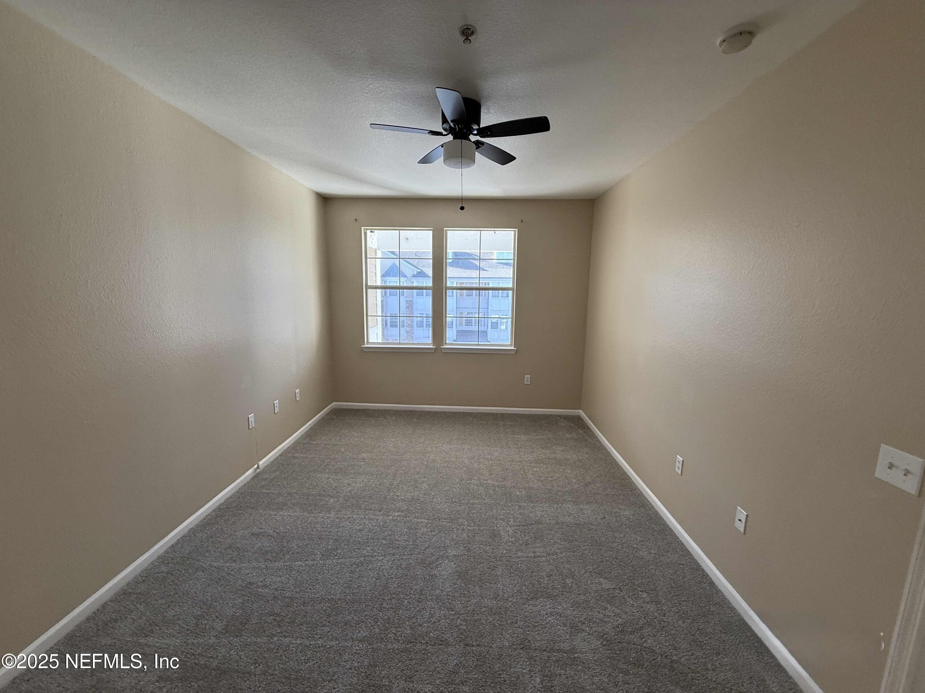 8550 Touchton Road, Unit 1633 Jacksonville, FL 32216 - Photo 17 of 21 an empty room with a window