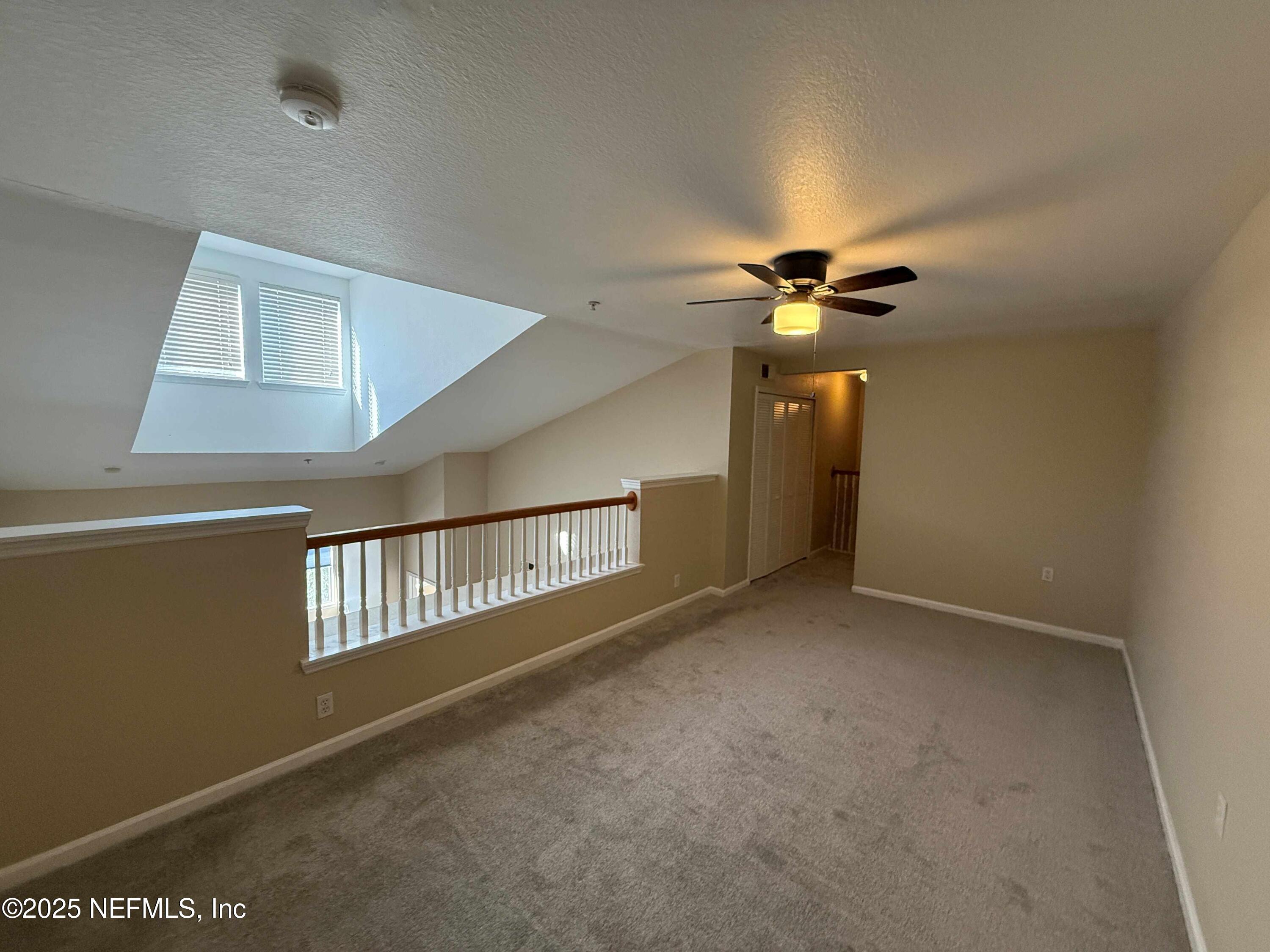 8550 Touchton Road, Unit 1633 Jacksonville, FL 32216 - Photo 20 of 21 a view of an empty room with a window