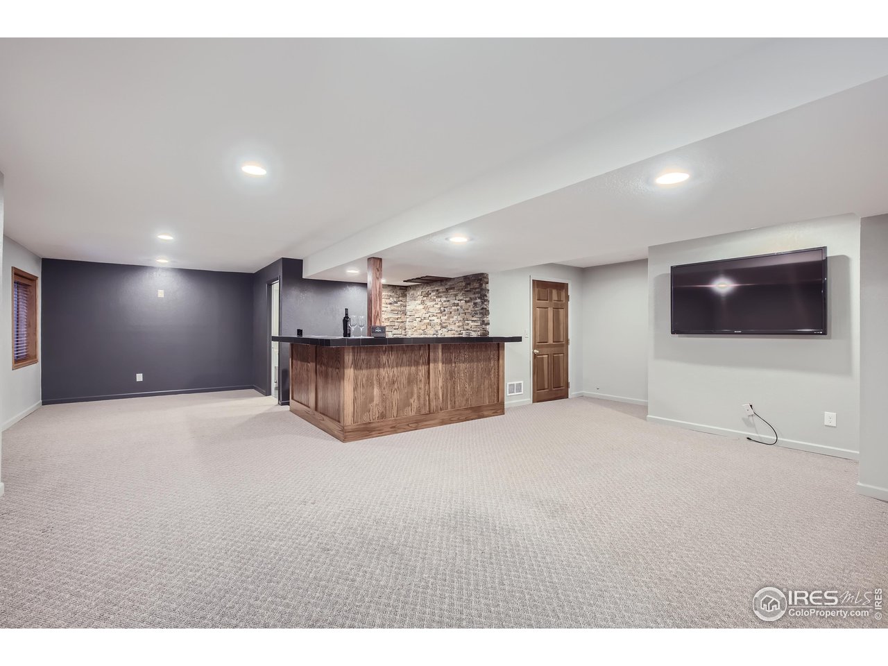 2700 Stanford Road, Unit 34 Fort Collins, CO 80525 - Photo 13 of 21 Beautiful basement bar and rec area (TV included!)