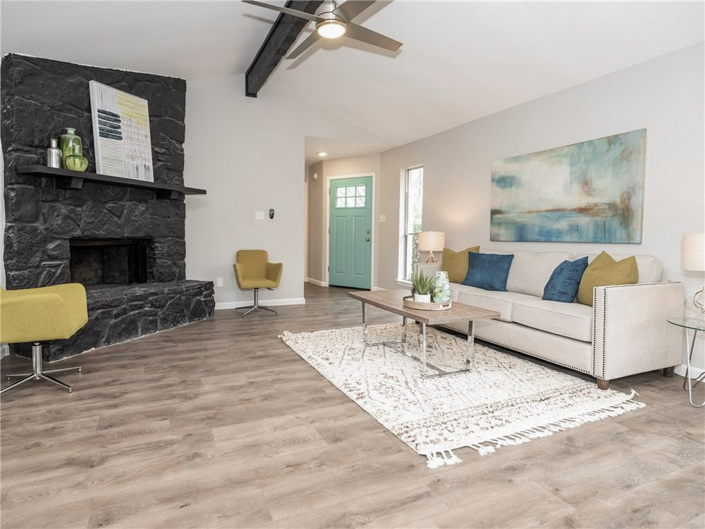 11118 Wandering Way Austin, TX 78754 - Photo 5 of 35 Unit A Living room with wood burning fireplace