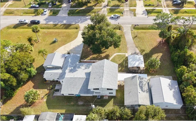 an aerial view of a house with swimming pool