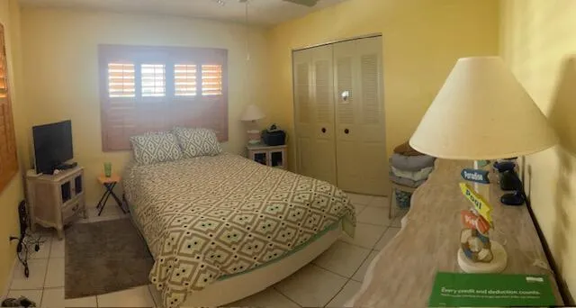 a bed room with a bed and a window