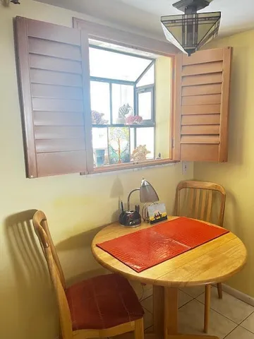 a blue table sitting next to a window