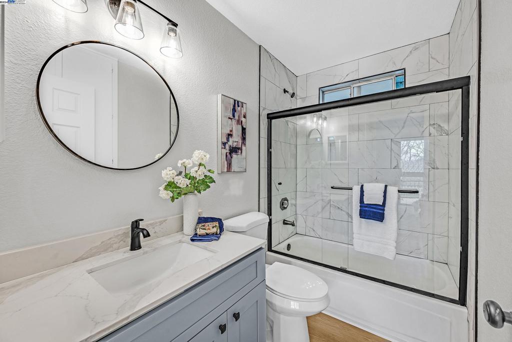 7815 Canyon Meadows Circle Pleasanton, CA 94588 - Photo 11 of 14 a bathroom with a sink a toilet and a mirror