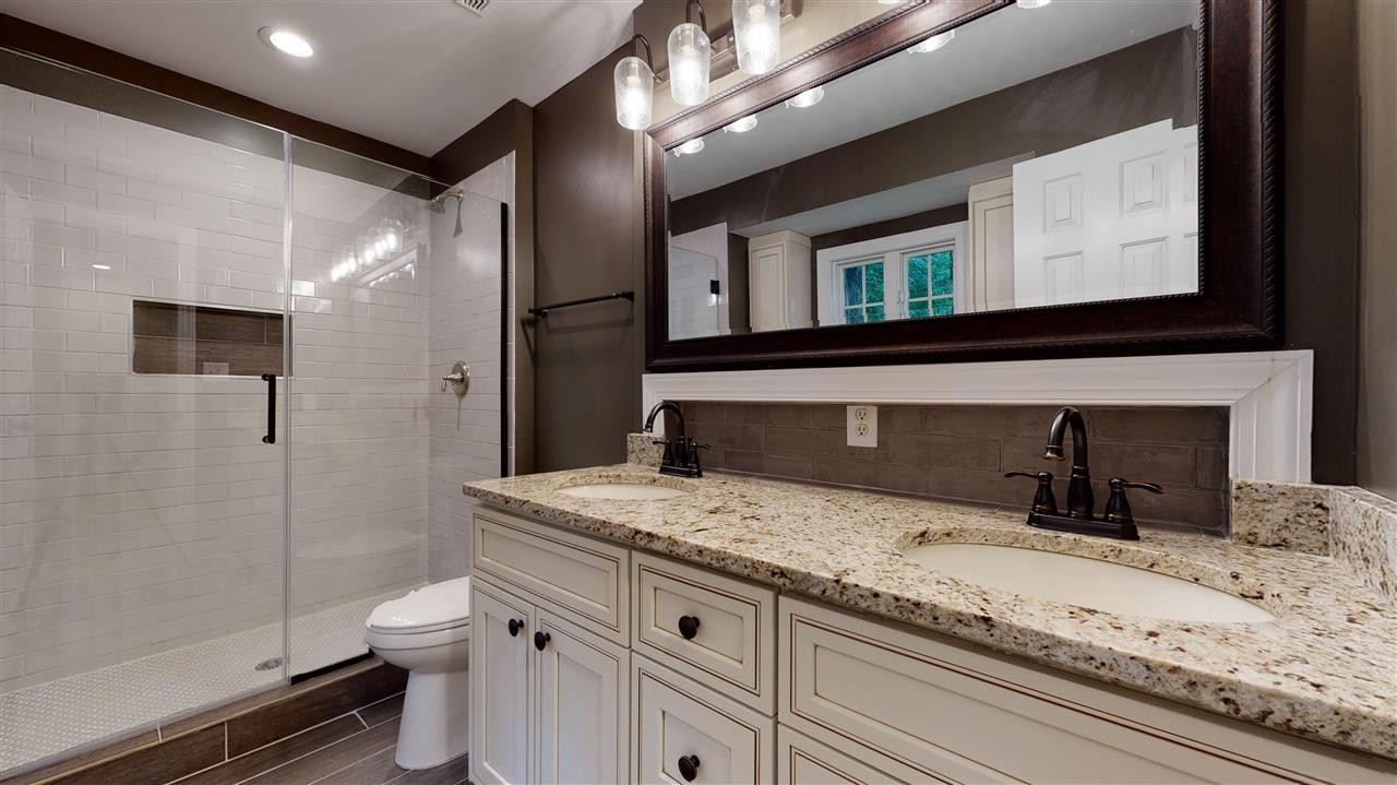 7920 Senter Farm Road Apex, NC 27539 - Photo 9 of 19 Master bath boasts tile shower, granite counter, double sink, LVT Floor. Master Bath/Spa