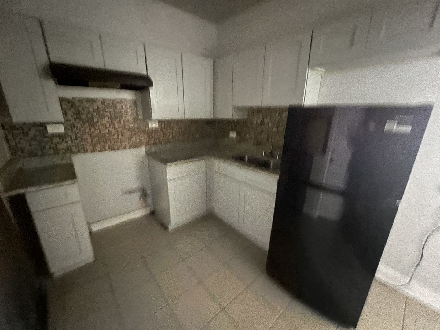 71 East 69th Street, Unit 2 Chicago, IL 60637 - Photo 5 of 6 a kitchen with a sink and refrigerator