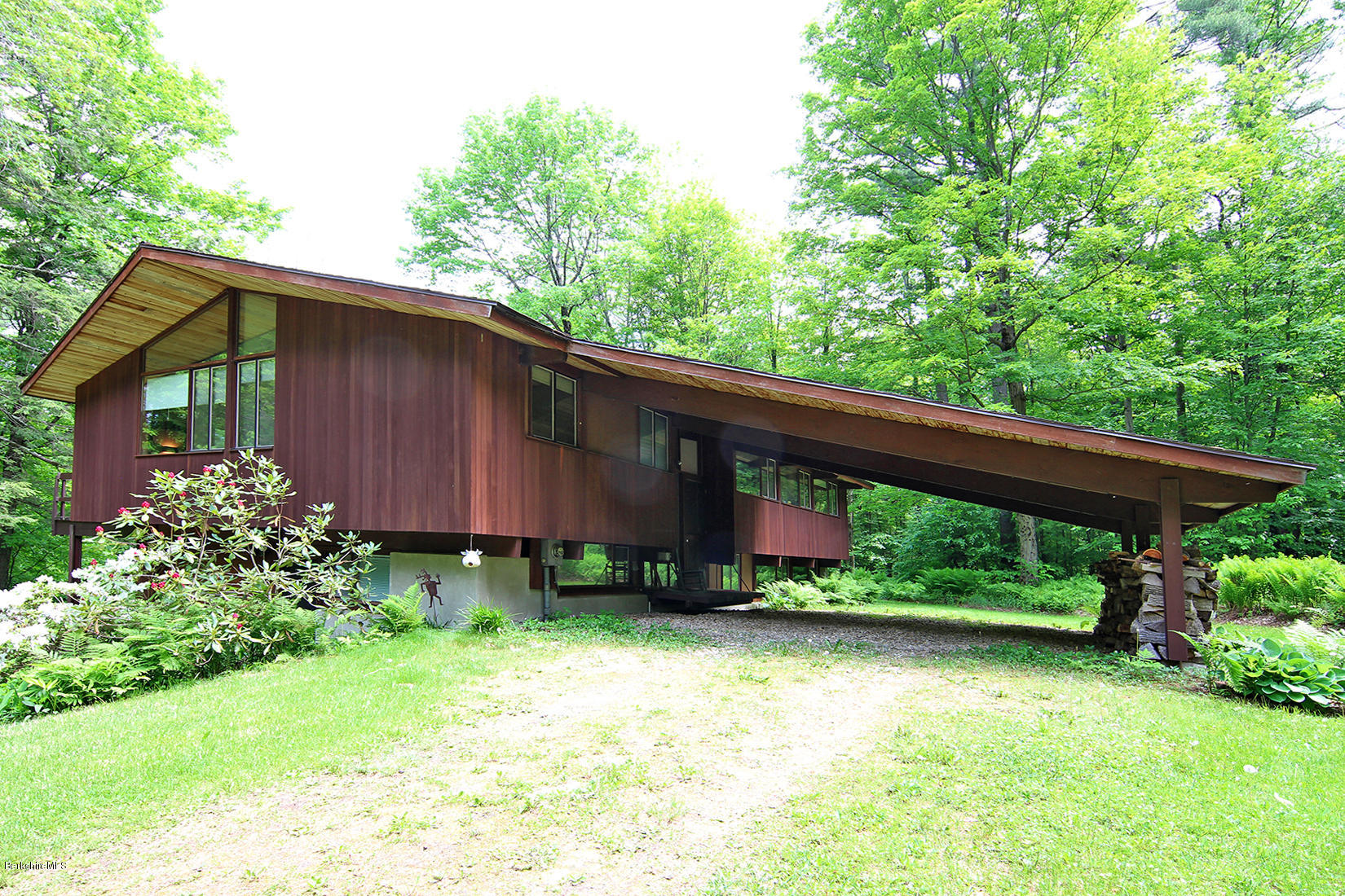 63 Monterey Road Tyringham, MA 01264 - Photo 2 of 34 a backyard of a house with lots of green space