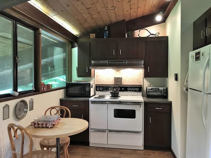 63 Monterey Road Tyringham, MA 01264 - Photo 12 of 34 a kitchen with a stove and a refrigerator