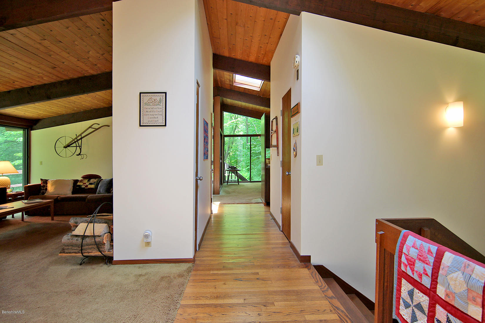 63 Monterey Road Tyringham, MA 01264 - Photo 13 of 34 a view of a porch with furniture and floor to ceiling window