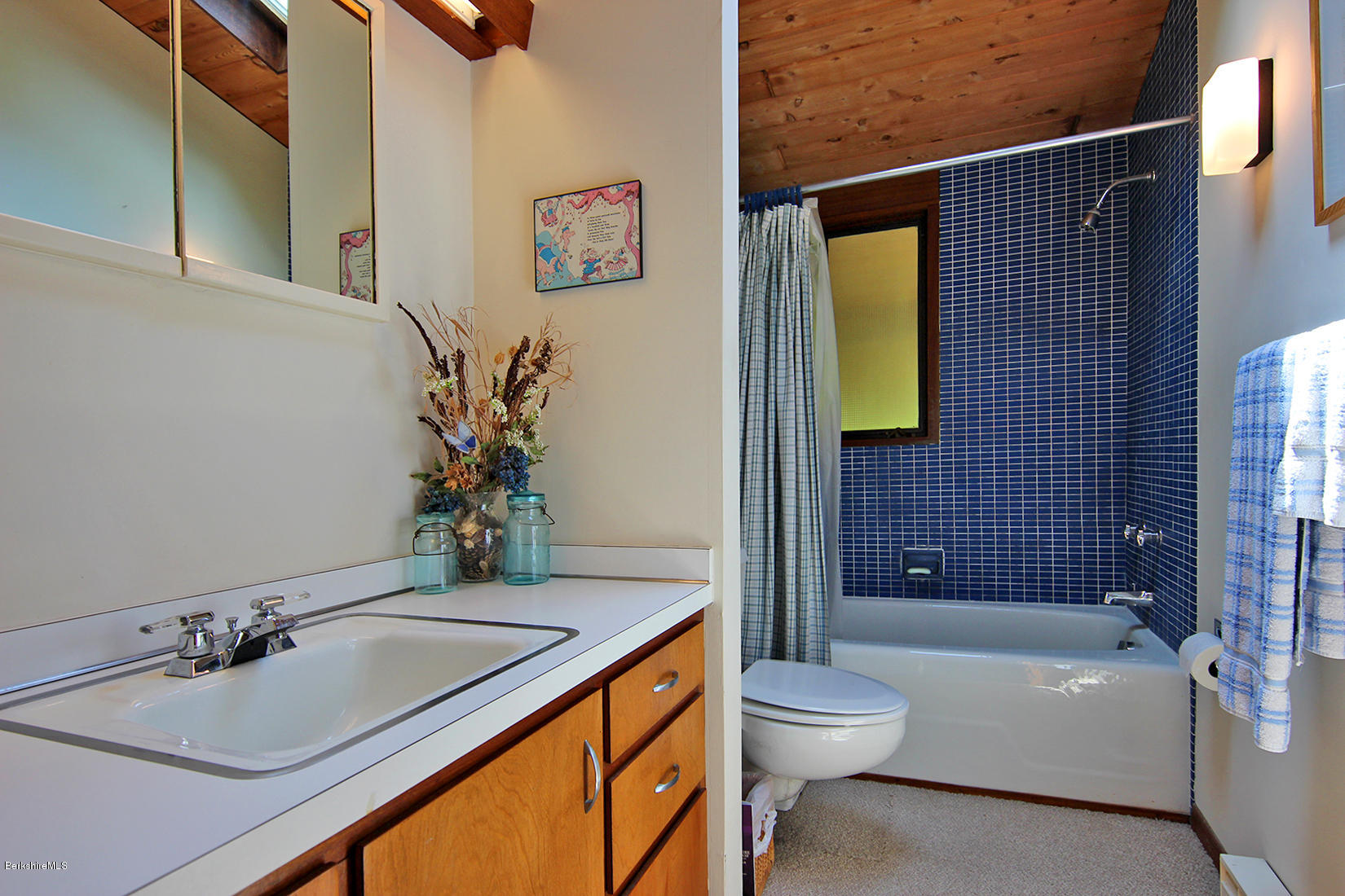 63 Monterey Road Tyringham, MA 01264 - Photo 16 of 34 a bathroom with a granite countertop sink a toilet and shower