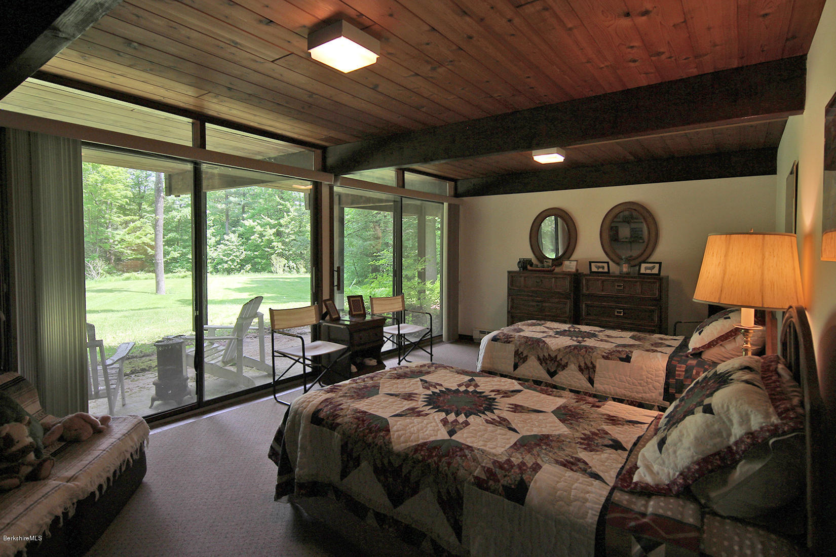 63 Monterey Road Tyringham, MA 01264 - Photo 18 of 34 a bed room with a bed and a large window