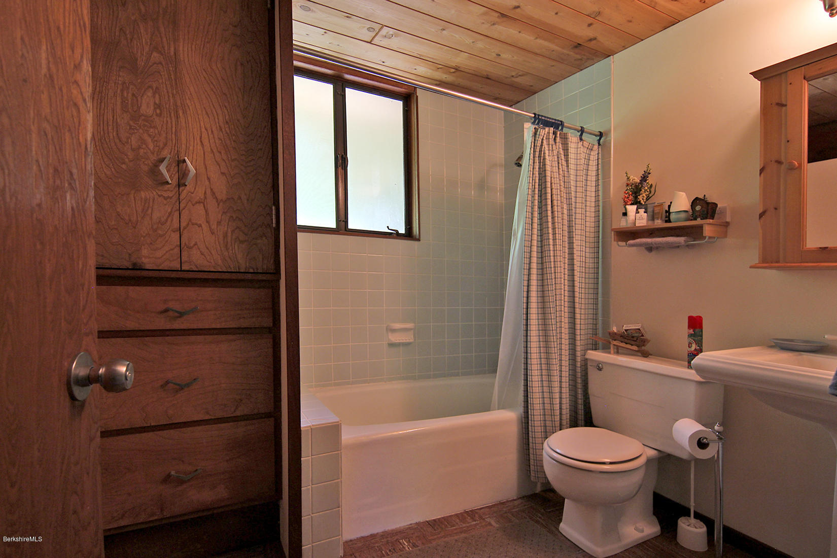 63 Monterey Road Tyringham, MA 01264 - Photo 20 of 34 a bathroom with a toilet sink and tub