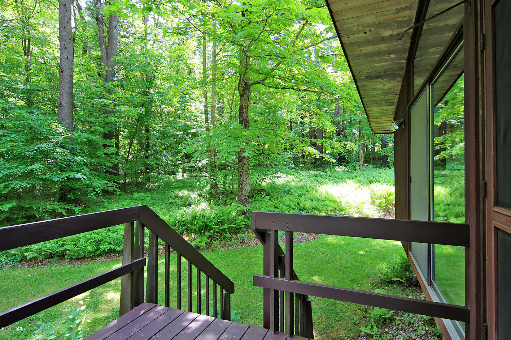 63 Monterey Road Tyringham, MA 01264 - Photo 28 of 34 a view of a wooden deck in forest