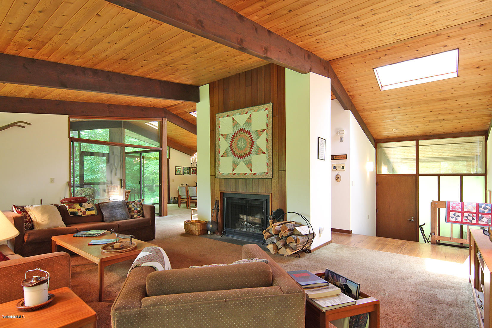63 Monterey Road Tyringham, MA 01264 - Photo 5 of 34 a living room with furniture fireplace and a large window