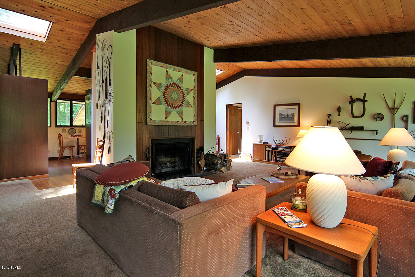 63 Monterey Road Tyringham, MA 01264 - Photo 6 of 34 a living room with furniture and a fireplace