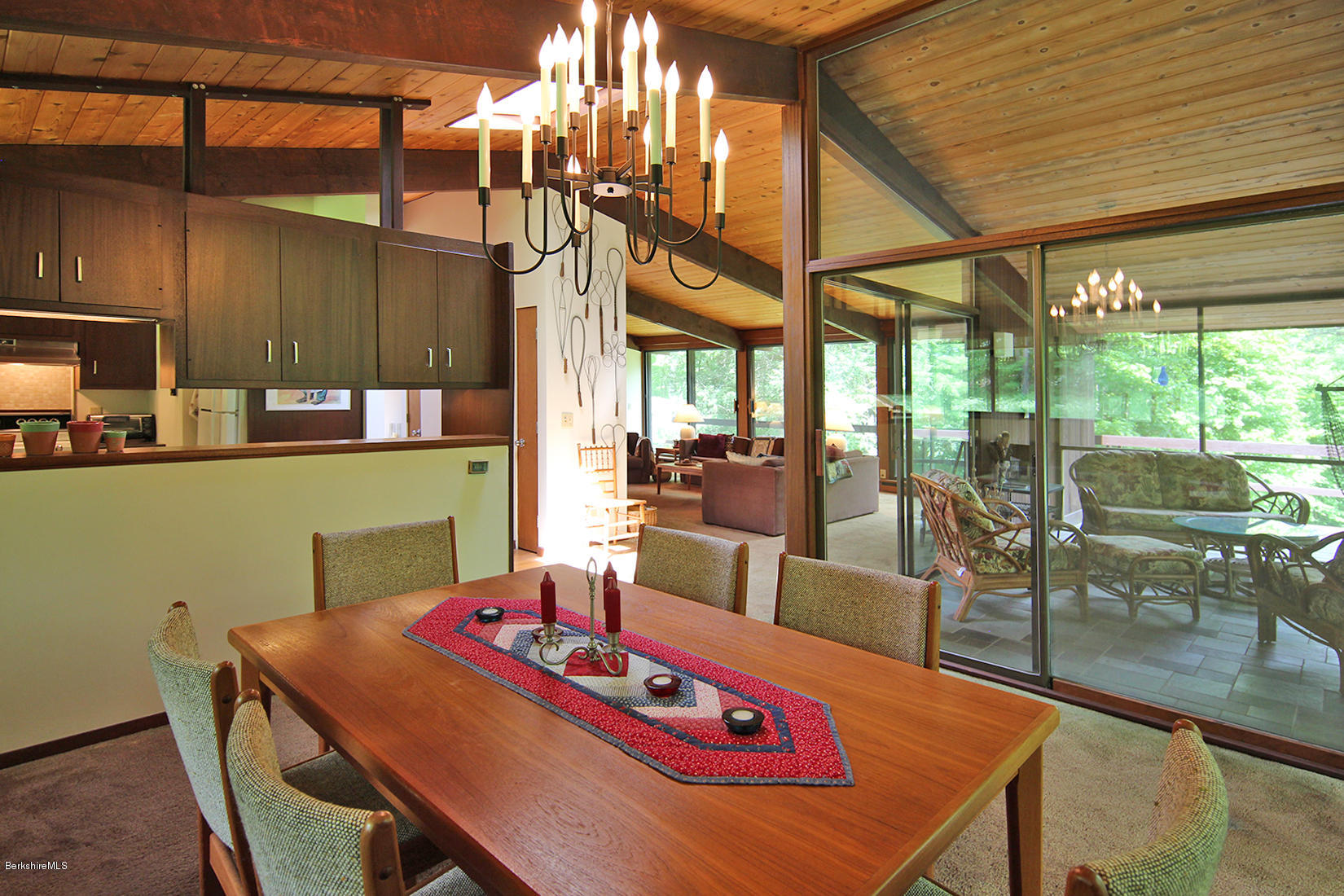 63 Monterey Road Tyringham, MA 01264 - Photo 9 of 34 a view of a dining room with furniture a chandelier and wooden floor