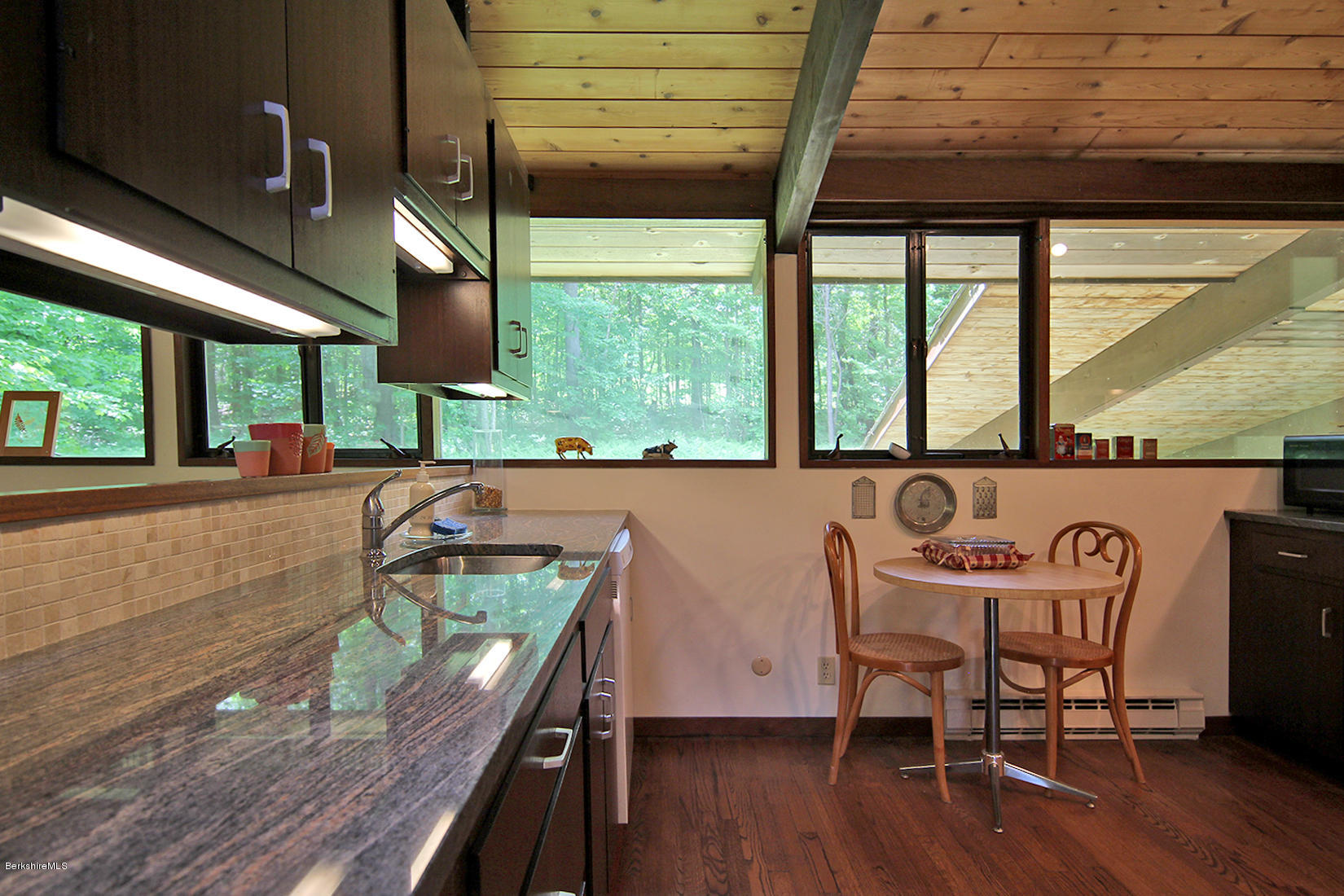 63 Monterey Road Tyringham, MA 01264 - Photo 10 of 34 a view of a dining room with furniture window and outside view