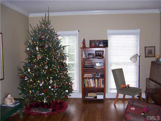 8005 Tanjier Bay Raleigh, NC 27613 - Photo 10 of 25 Separate living room with double french doors that open into the family room