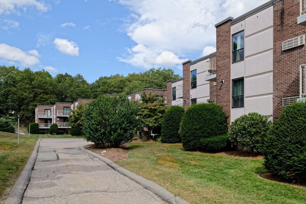 147 Turner Road, Unit 98 Holliston, MA 01746 - Photo 11 of 42 a house view with a garden space