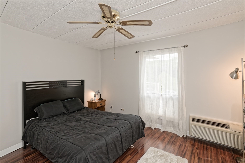147 Turner Road, Unit 98 Holliston, MA 01746 - Photo 14 of 42 a bedroom with a bed and a ceiling fan