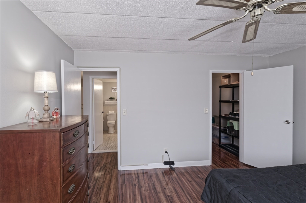 147 Turner Road, Unit 98 Holliston, MA 01746 - Photo 16 of 42 a view of a room with wooden floor and closet