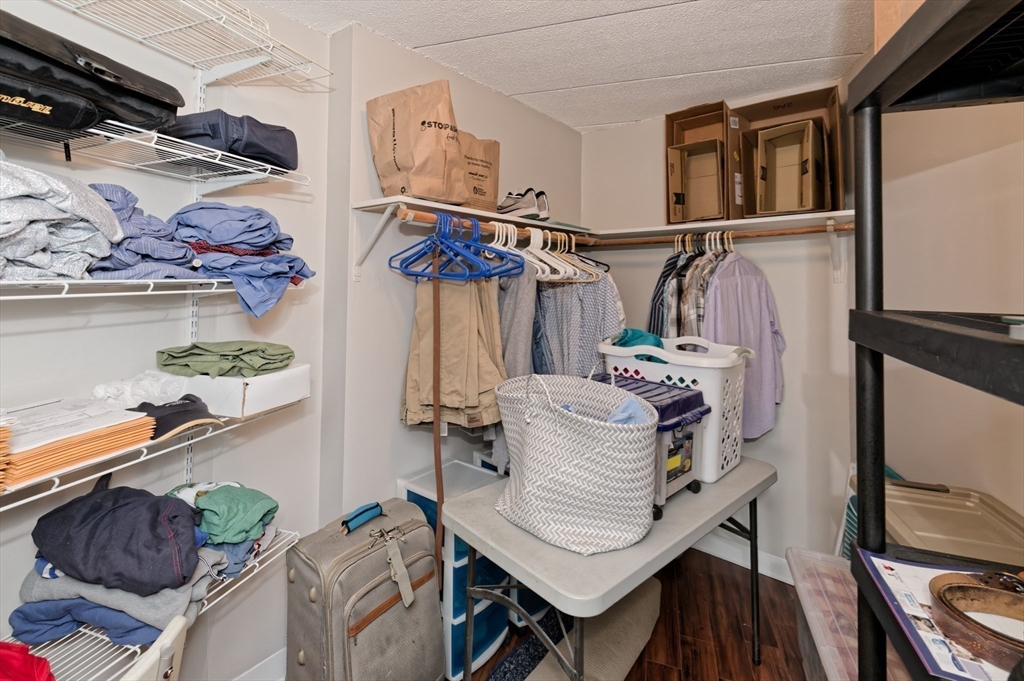 147 Turner Road, Unit 98 Holliston, MA 01746 - Photo 19 of 42 a view of walk in closet with clothes and shoes