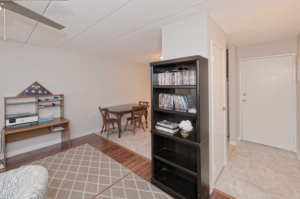 147 Turner Road, Unit 98 Holliston, MA 01746 - Photo 25 of 42 a living room with furniture a rug and a window