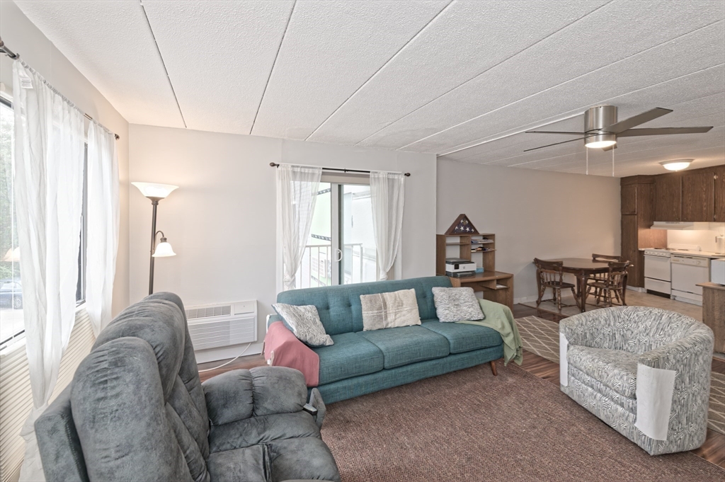 147 Turner Road, Unit 98 Holliston, MA 01746 - Photo 28 of 42 a living room with furniture and a window