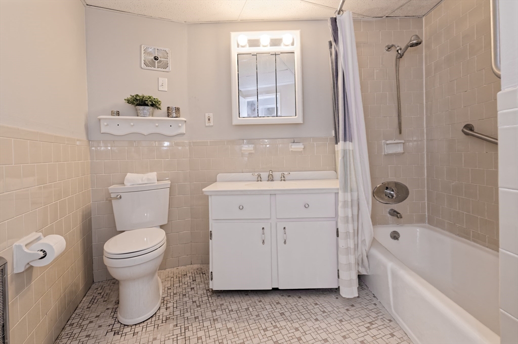 147 Turner Road, Unit 98 Holliston, MA 01746 - Photo 32 of 42 a bathroom with a sink toilet and shower
