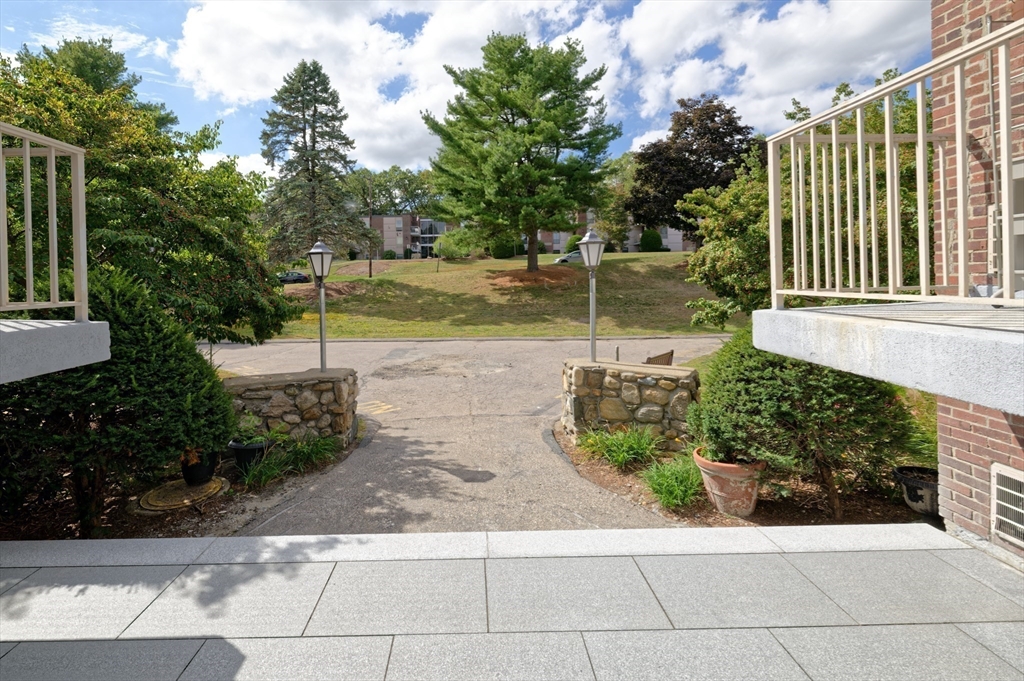 147 Turner Road, Unit 98 Holliston, MA 01746 - Photo 40 of 42 a view of a garden with a lake