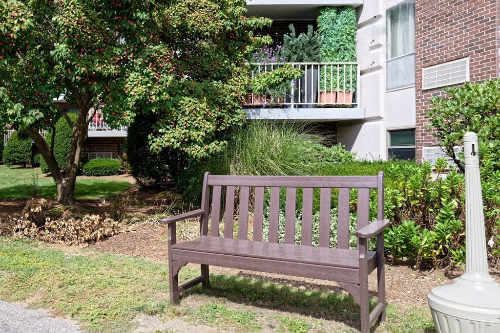 147 Turner Road, Unit 98 Holliston, MA 01746 - Photo 5 of 42 a view of a bench in the garden