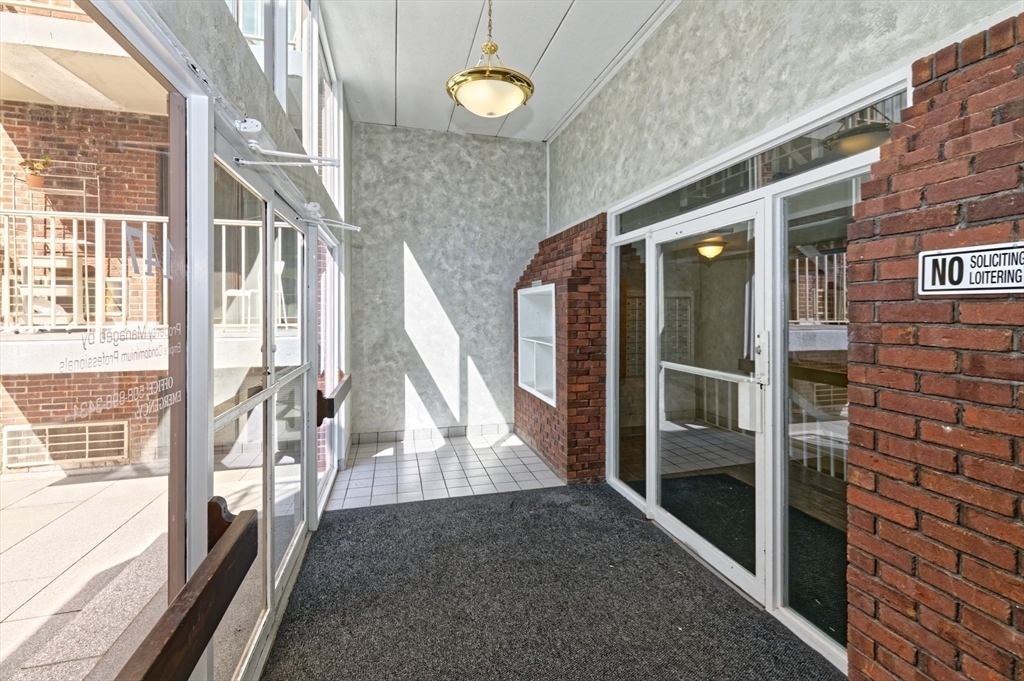 147 Turner Road, Unit 98 Holliston, MA 01746 - Photo 8 of 42 a view of front door of house with stairs