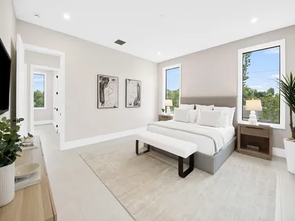 a bedroom with a bed and a couch