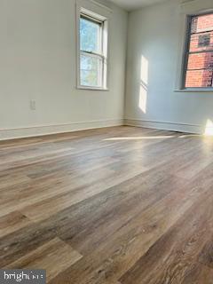 973 Monitor Road Camden, NJ 08104 - Photo 11 of 15 an empty room with wooden floor and windows