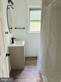 973 Monitor Road Camden, NJ 08104 - Photo 14 of 15 a bathroom with a sink and mirror