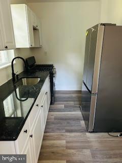 973 Monitor Road Camden, NJ 08104 - Photo 9 of 15 a kitchen with granite countertop a refrigerator and a sink