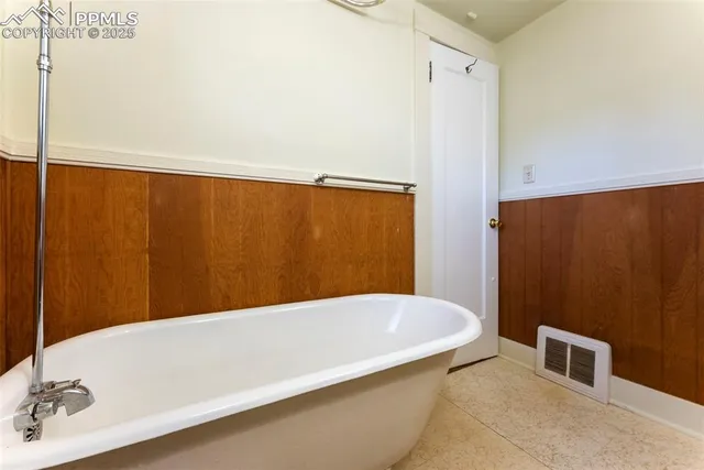 a bathroom with a bathtub and a sink