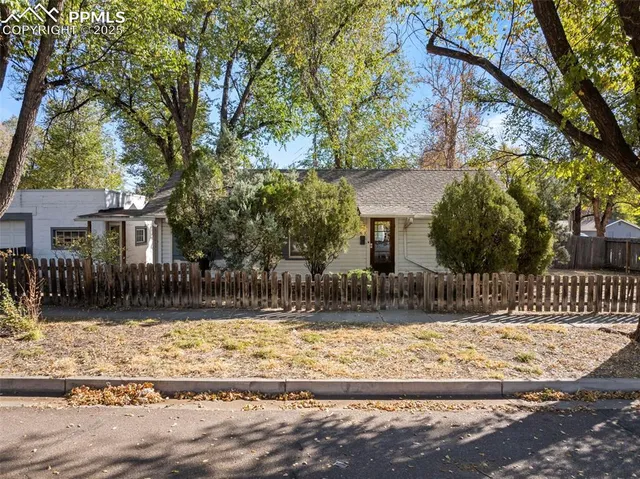a view of a house with snow on the tree