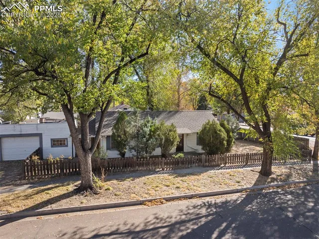 a view of a house with snow on the tree