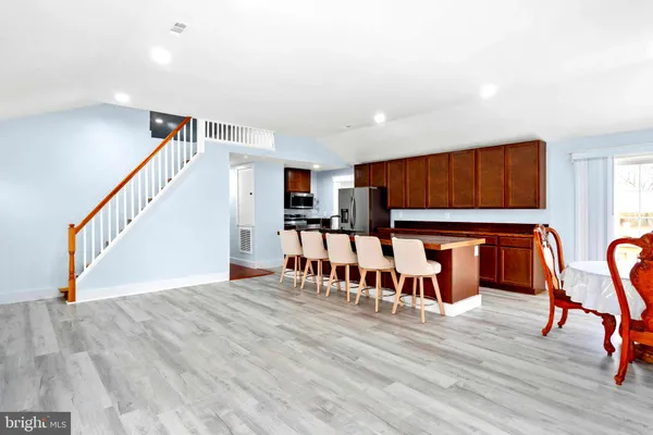 a view of entryway wih livingroom and stairs